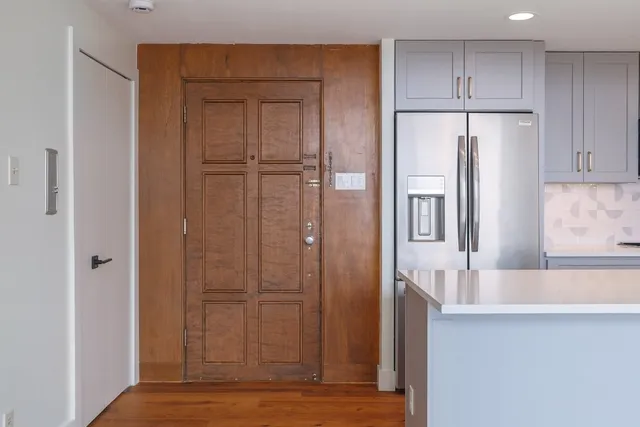a view of a kitchen from the hallway