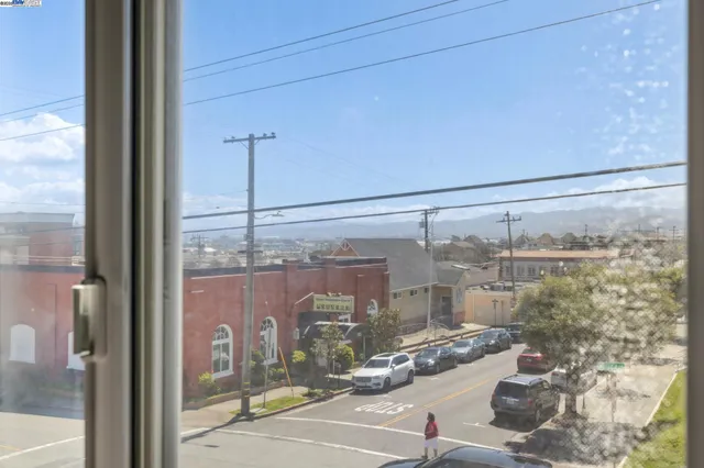 a room with water view and a floor to ceiling window