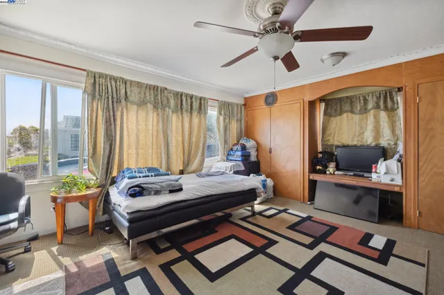 a bedroom with furniture and a window