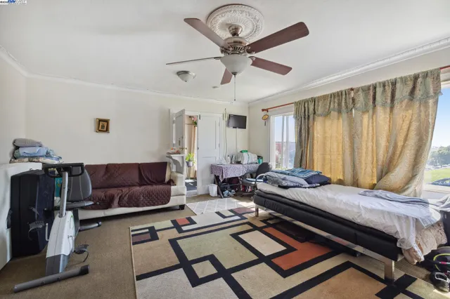 a bed room with furniture and a window