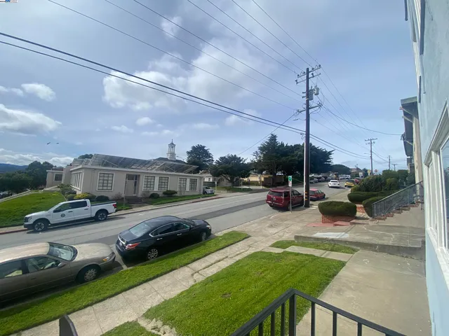 a view of a house with backyard porch and sitting area