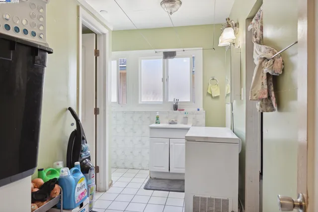 a bathroom with a sink mirror and shower