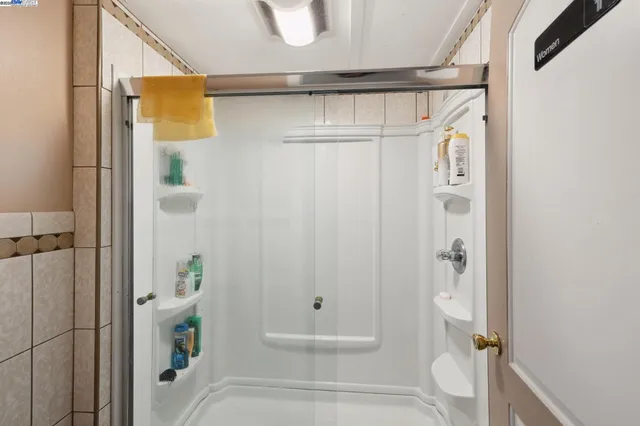a bathroom with a shower and toilet