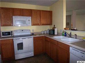 2239 Durand Road Fort Mill, SC 29715 - Photo 7 of 13 a kitchen with stainless steel appliances granite countertop a sink stove and cabinets