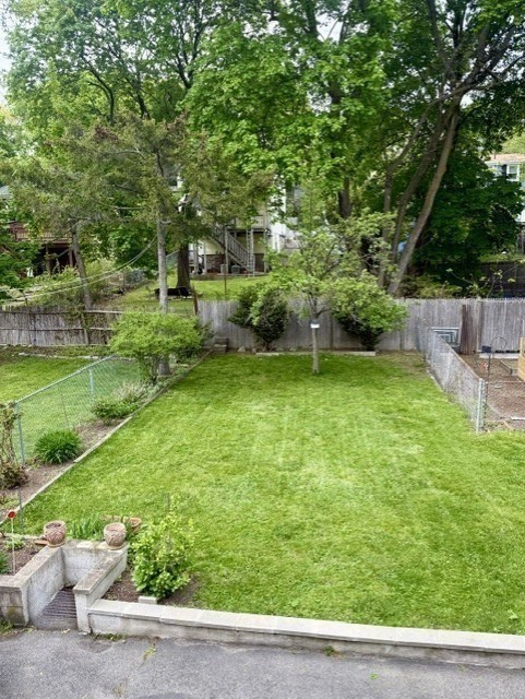 25 Glendower Road, Unit 2 Boston, MA 02131 - Photo 16 of 17 a view of a backyard with a garden