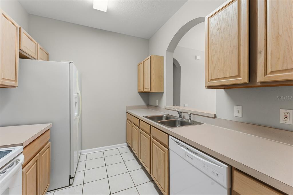 1224 South Hiawassee Road, Unit 636 Orlando, FL 32835 - Photo 15 of 43 a kitchen with a sink and cabinets