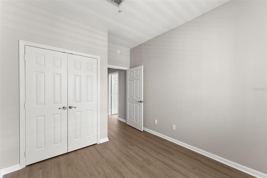 1224 South Hiawassee Road, Unit 636 Orlando, FL 32835 - Photo 23 of 43 a view of an empty room with closet and a window