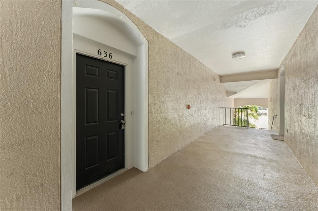 1224 South Hiawassee Road, Unit 636 Orlando, FL 32835 - Photo 3 of 43 a view of a hallway with wooden floor and closet area