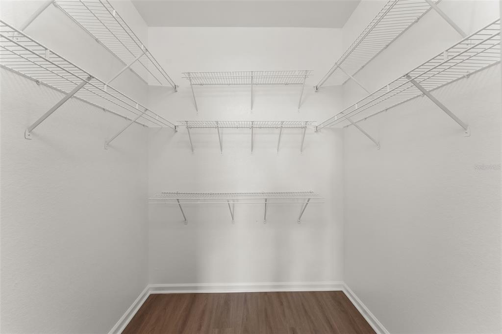 1224 South Hiawassee Road, Unit 636 Orlando, FL 32835 - Photo 31 of 43 a view of a room with racks on the wall