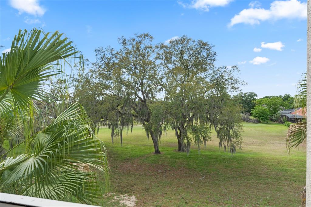 1224 South Hiawassee Road, Unit 636 Orlando, FL 32835 - Photo 33 of 43 a view of a lake with a building in the background