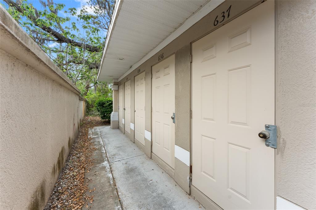 1224 South Hiawassee Road, Unit 636 Orlando, FL 32835 - Photo 38 of 43 a view of a pathway with a yard