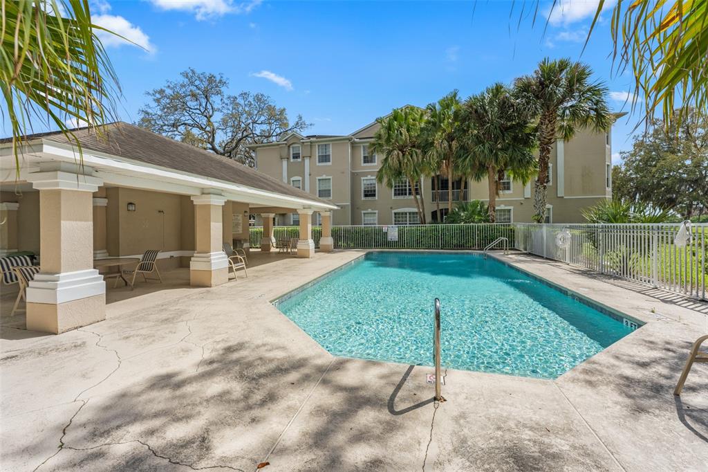 1224 South Hiawassee Road, Unit 636 Orlando, FL 32835 - Photo 42 of 43 a view of a house with a patio