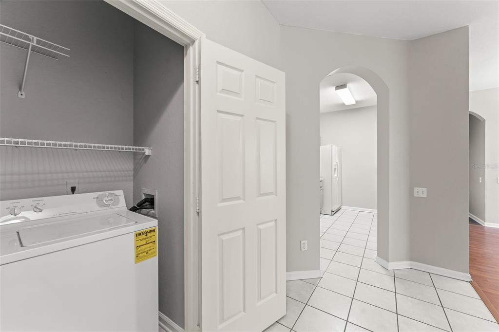 1224 South Hiawassee Road, Unit 636 Orlando, FL 32835 - Photo 5 of 43 a utility room with dryer and washer