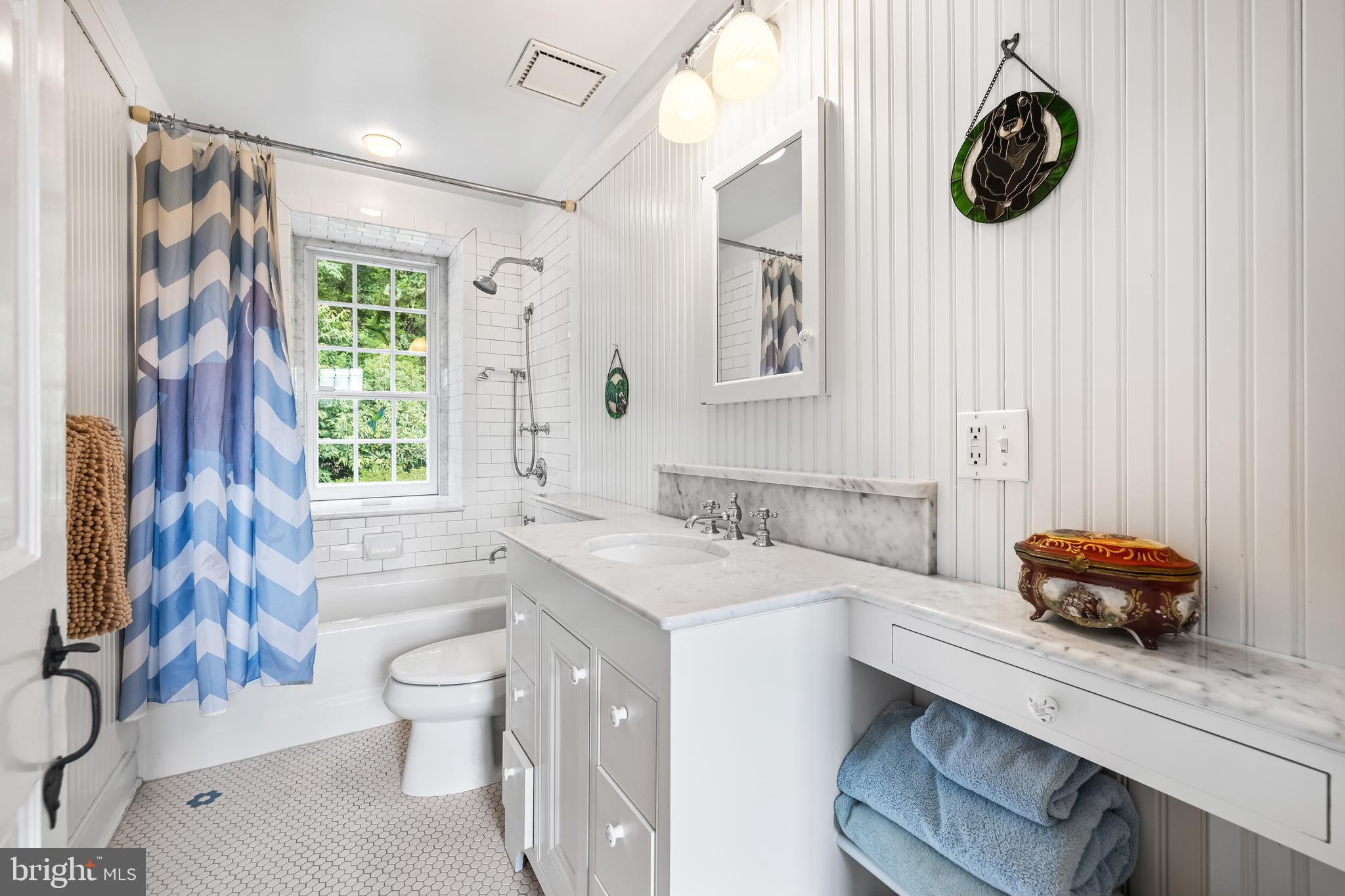 14921 Tanyard Road Sparks Glencoe, MD 21152 - Photo 44 of 150 a bathroom with a sink a toilet and shower curtain