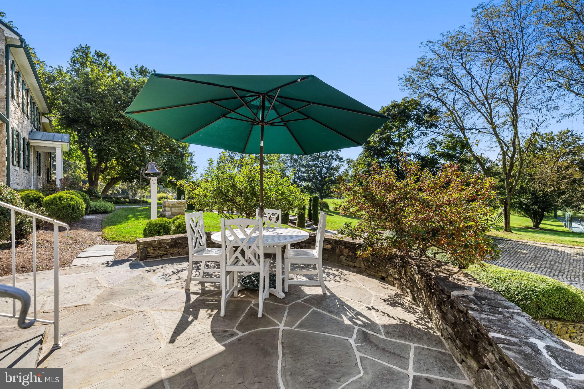 14921 Tanyard Road Sparks Glencoe, MD 21152 - Photo 57 of 150 a view of an outdoor sitting area with chairs and an umbrella