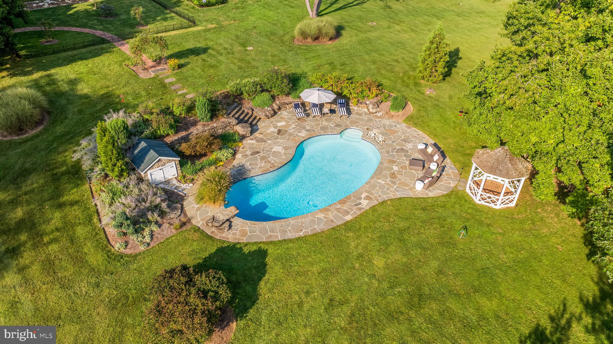 14921 Tanyard Road Sparks Glencoe, MD 21152 - Photo 68 of 150 a view of a swimming pool with a yard