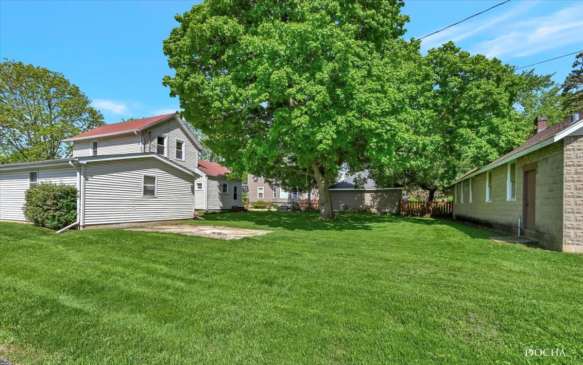 321 Fulton Street West Chicago, IL 60185 - Photo 19 of 21 a front view of house with yard and trees