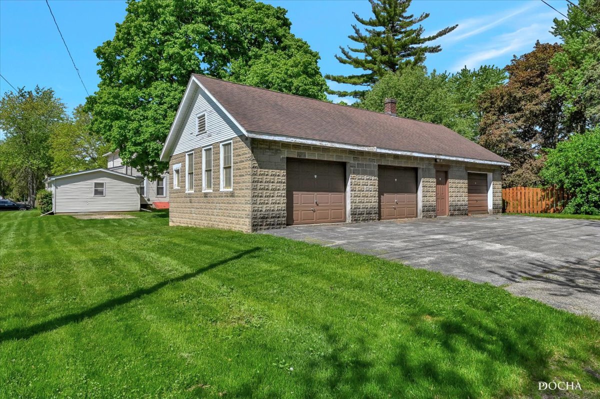 321 Fulton Street West Chicago, IL 60185 - Photo 20 of 21 a front view of house with yard and green space