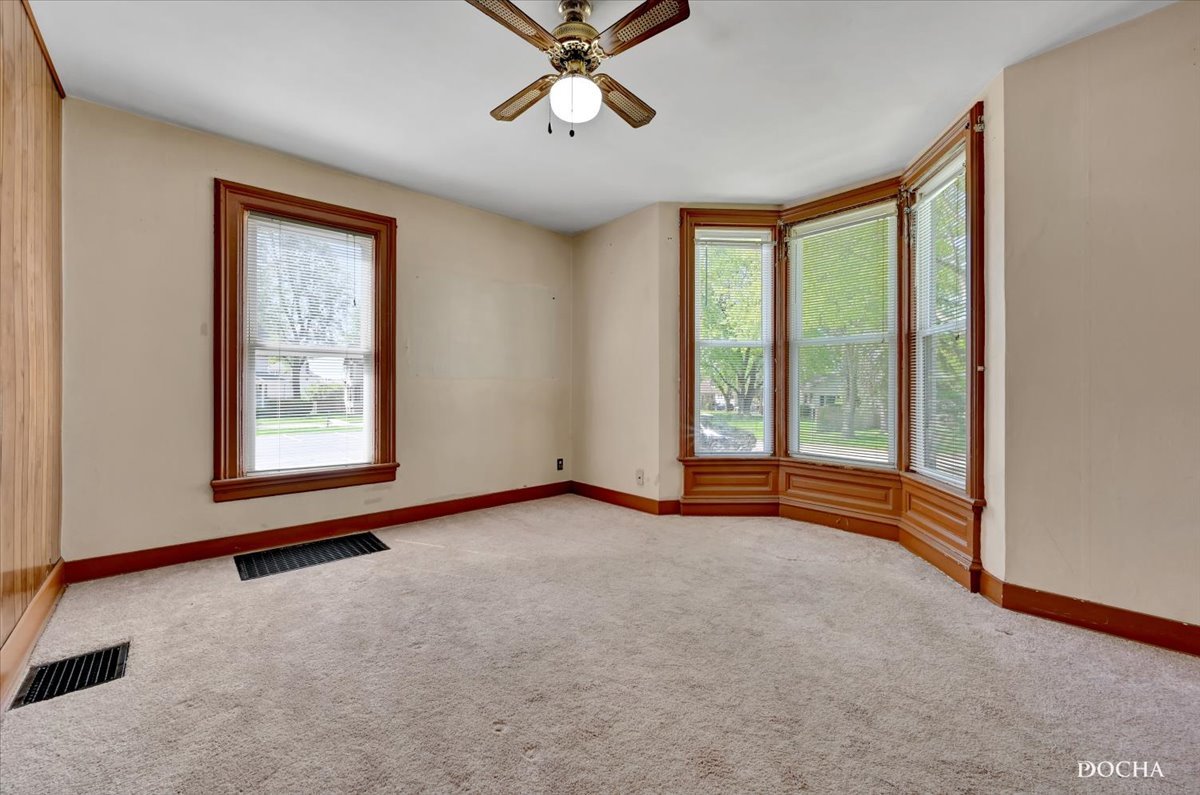 321 Fulton Street West Chicago, IL 60185 - Photo 4 of 21 a view of an empty room with a window