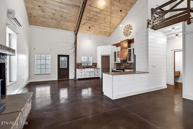 a view of a livingroom with wooden floor