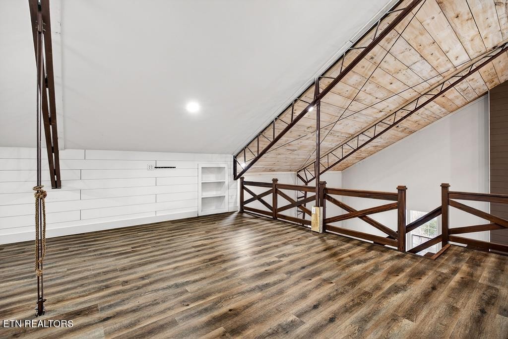 1425 Moodyville Loop Pall Mall, TN 38577 - Photo 33 of 60 a view of an empty room with stairs and wooden floor