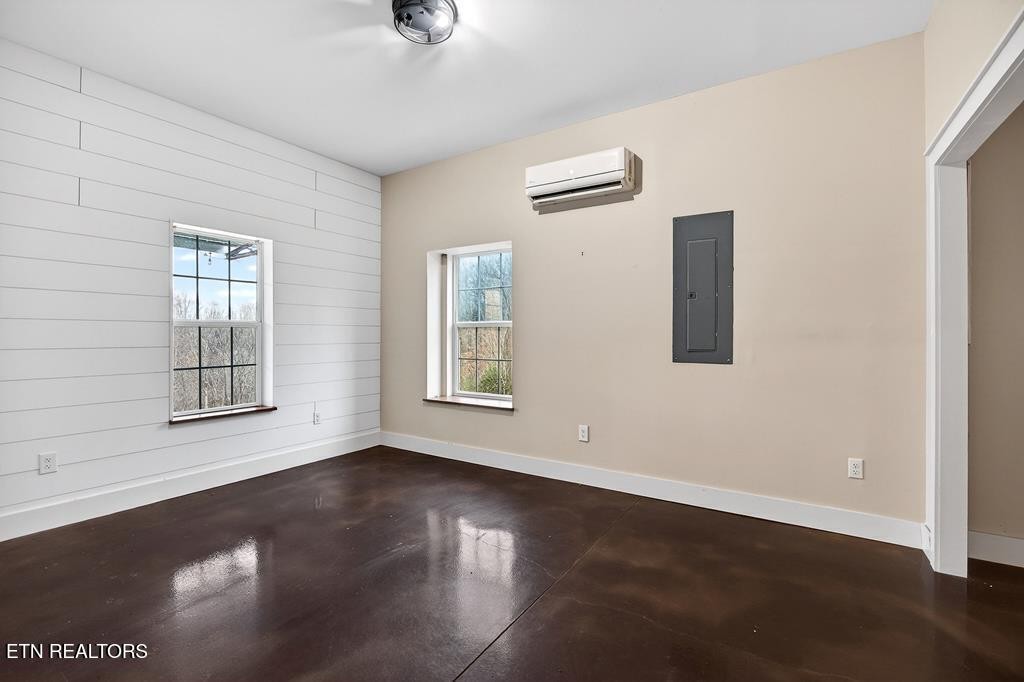 1425 Moodyville Loop Pall Mall, TN 38577 - Photo 37 of 60 an empty room with wooden floor and windows