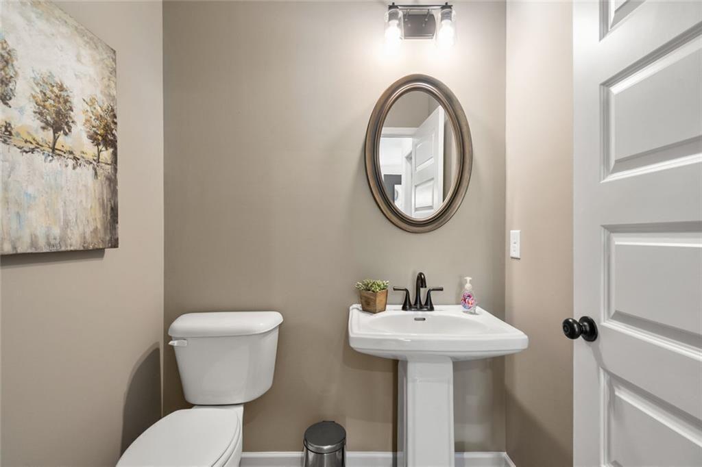 131 Sycamore Lane Calhoun, GA 30701 - Photo 15 of 31 a bathroom with a toilet sink and mirror