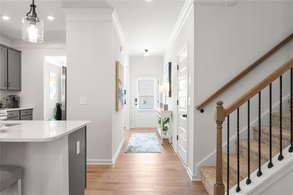 131 Sycamore Lane Calhoun, GA 30701 - Photo 5 of 31 a view of a hallway with wooden floor and staircase