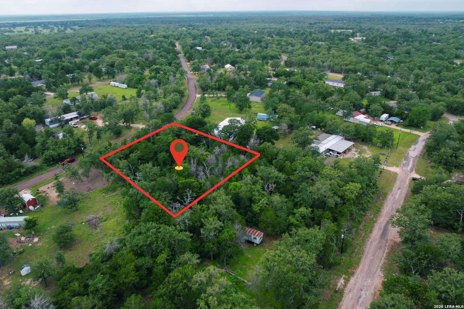 583 Blueberry Hill Road Somerville, TX 77879 - Photo 14 of 19 an aerial view of residential houses with outdoor space and trees