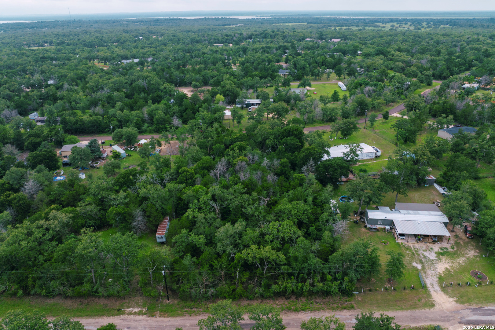 583 Blueberry Hill Road Somerville, TX 77879 - Photo 17 of 19 an aerial view of a house with a yard