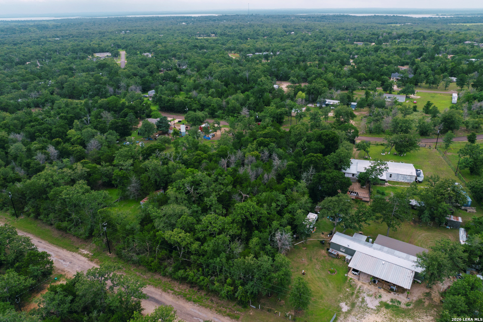 583 Blueberry Hill Road Somerville, TX 77879 - Photo 18 of 19 an aerial view of a house with a yard