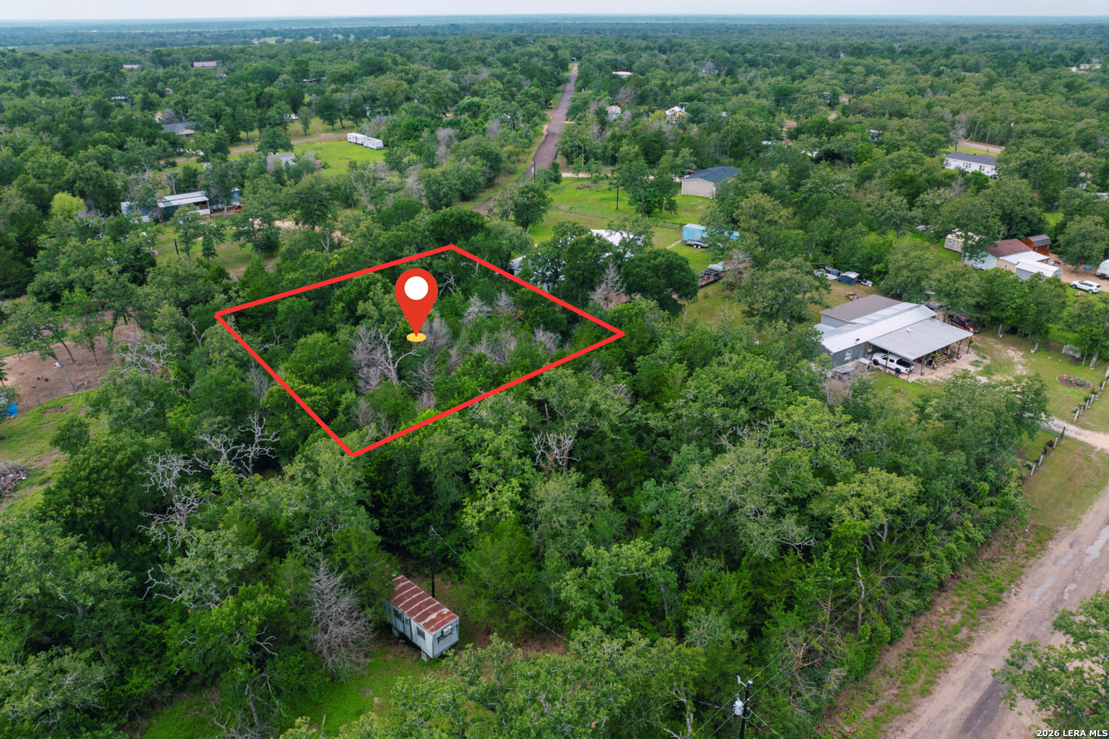 583 Blueberry Hill Road Somerville, TX 77879 - Photo 8 of 19 an aerial view of residential house with outdoor space and trees all around