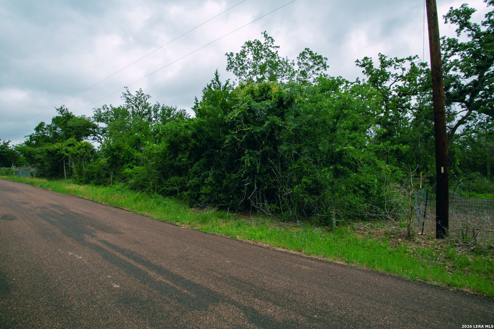 583 Blueberry Hill Road Somerville, TX 77879 - Photo 10 of 19 a view of a yard and basketball court