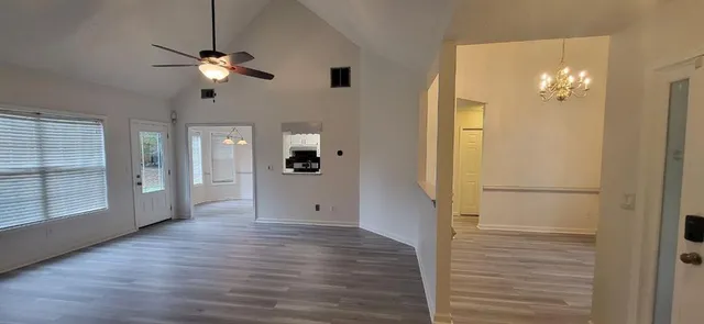 wooden floor in an empty room with a mirror