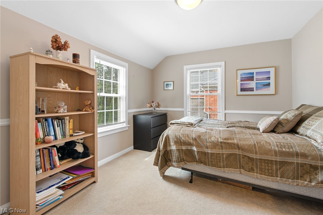 4206 Silsby Road Cleveland, OH 44118 - Photo 23 of 32 Carpeted bedroom with vaulted ceiling