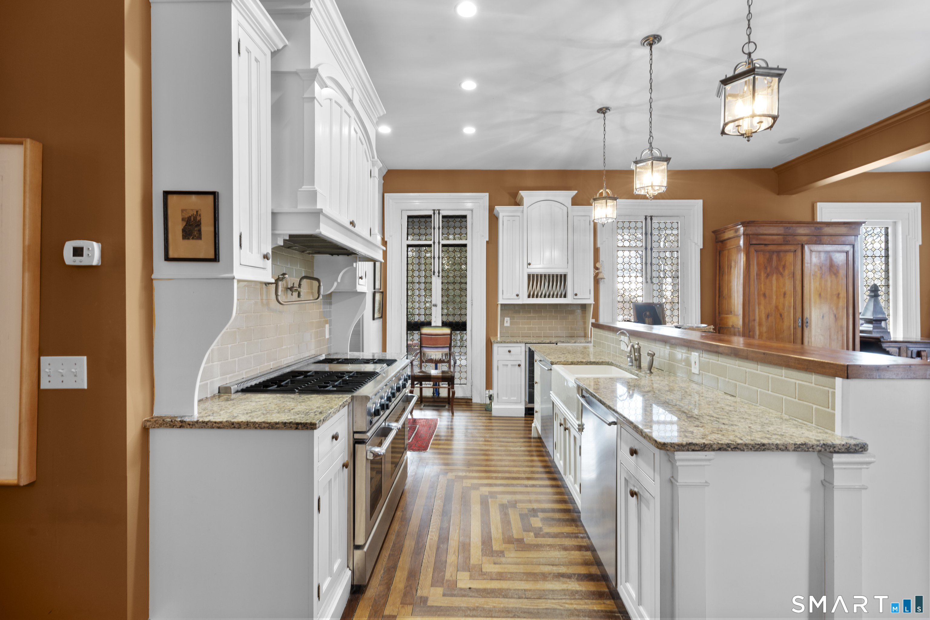 91 North Street Litchfield, CT 06759 - Photo 11 of 40 a kitchen with stainless steel appliances granite countertop a sink stove and refrigerator
