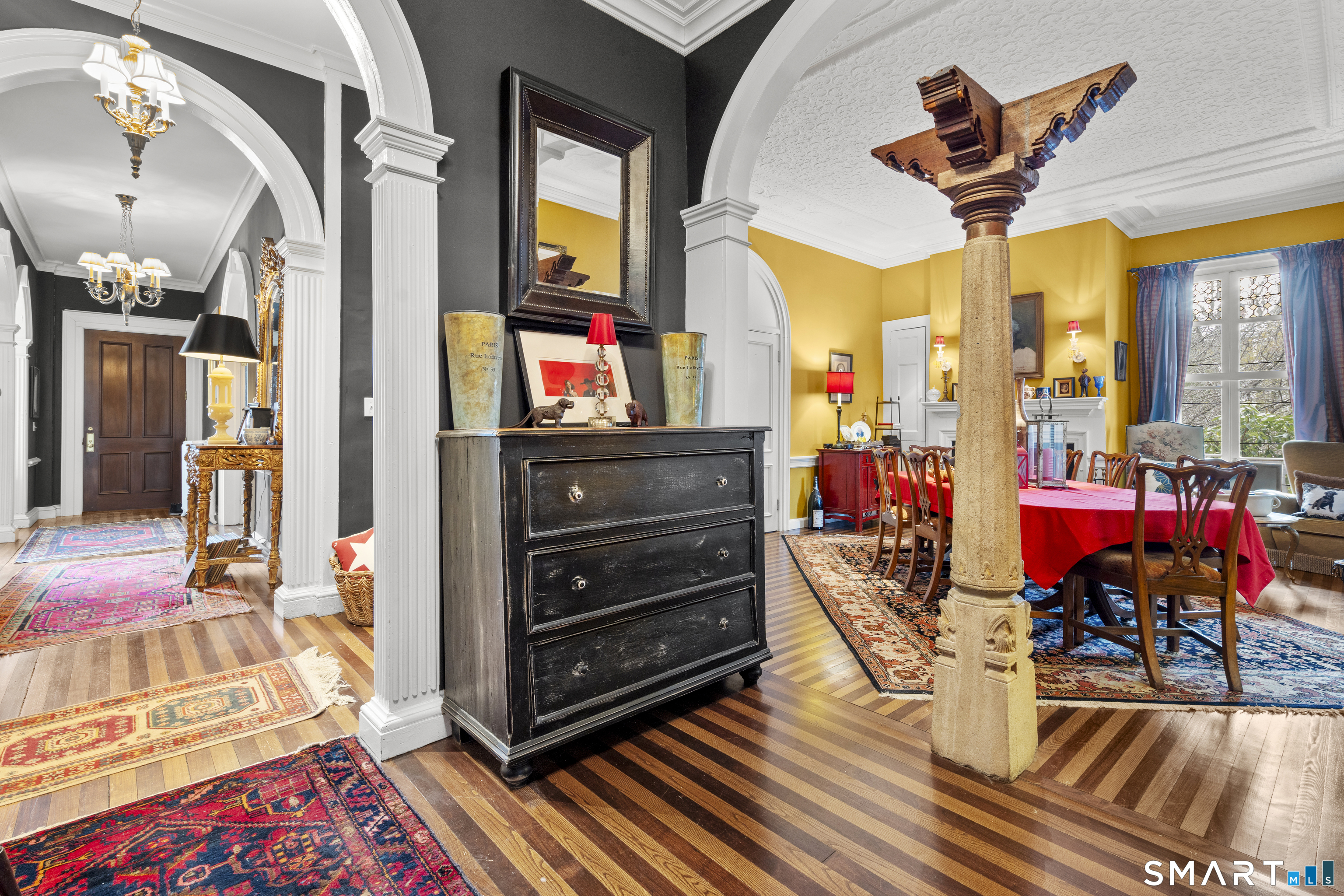 91 North Street Litchfield, CT 06759 - Photo 15 of 40 a view of a dining room with furniture and a chandelier