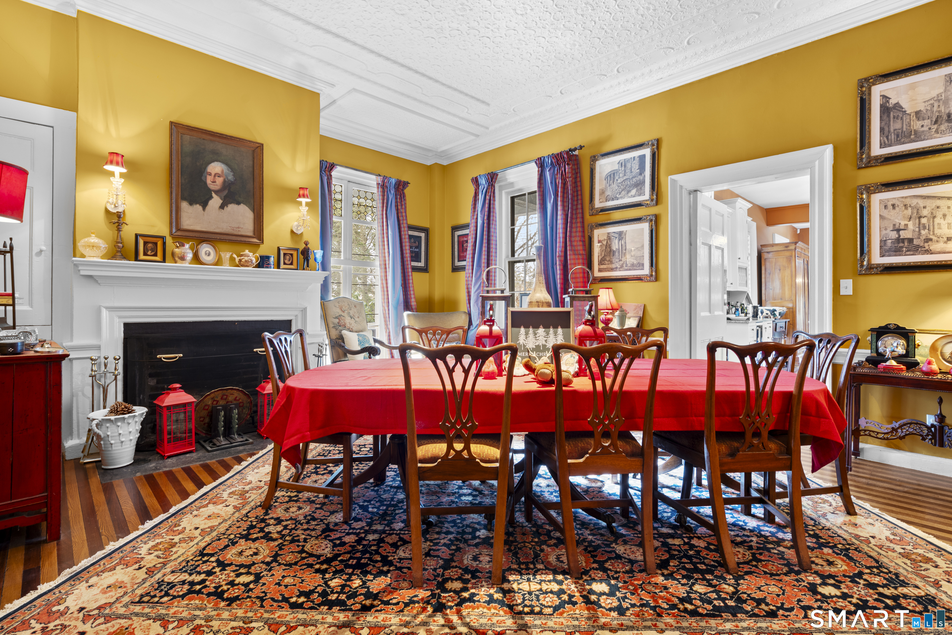 91 North Street Litchfield, CT 06759 - Photo 16 of 40 a dining room with furniture and a fireplace
