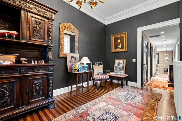 a living room with furniture and a chandelier