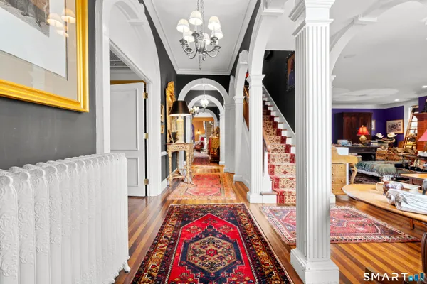 a view of an entryway with wooden floor