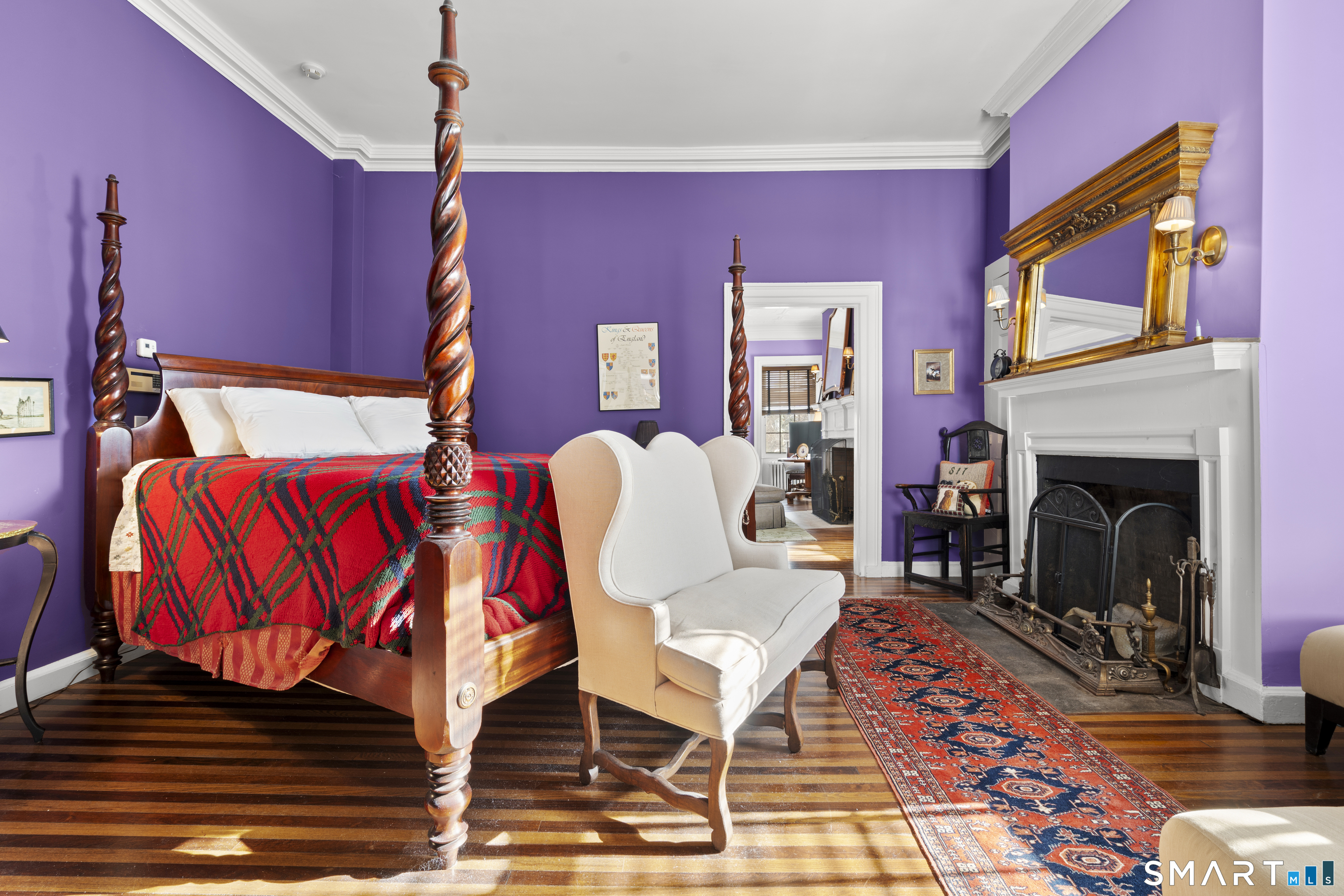 91 North Street Litchfield, CT 06759 - Photo 24 of 40 a living room with furniture a flat screen tv and a fireplace