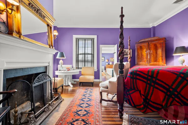 a spacious bedroom with a bed and a dresser