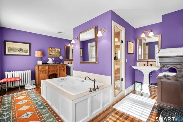 a bath room with a sink and a bath tub