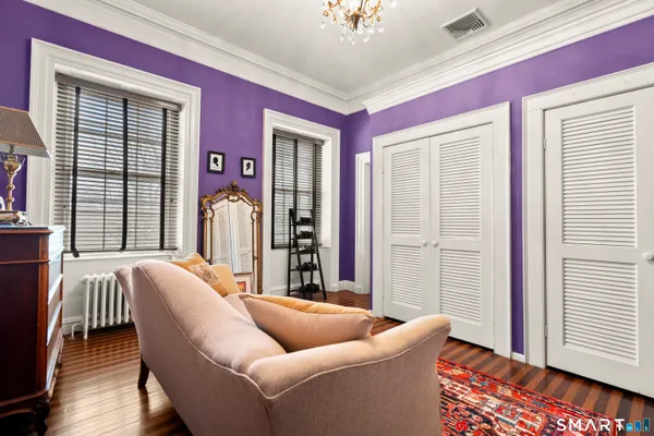 a bedroom with a bed and a fireplace