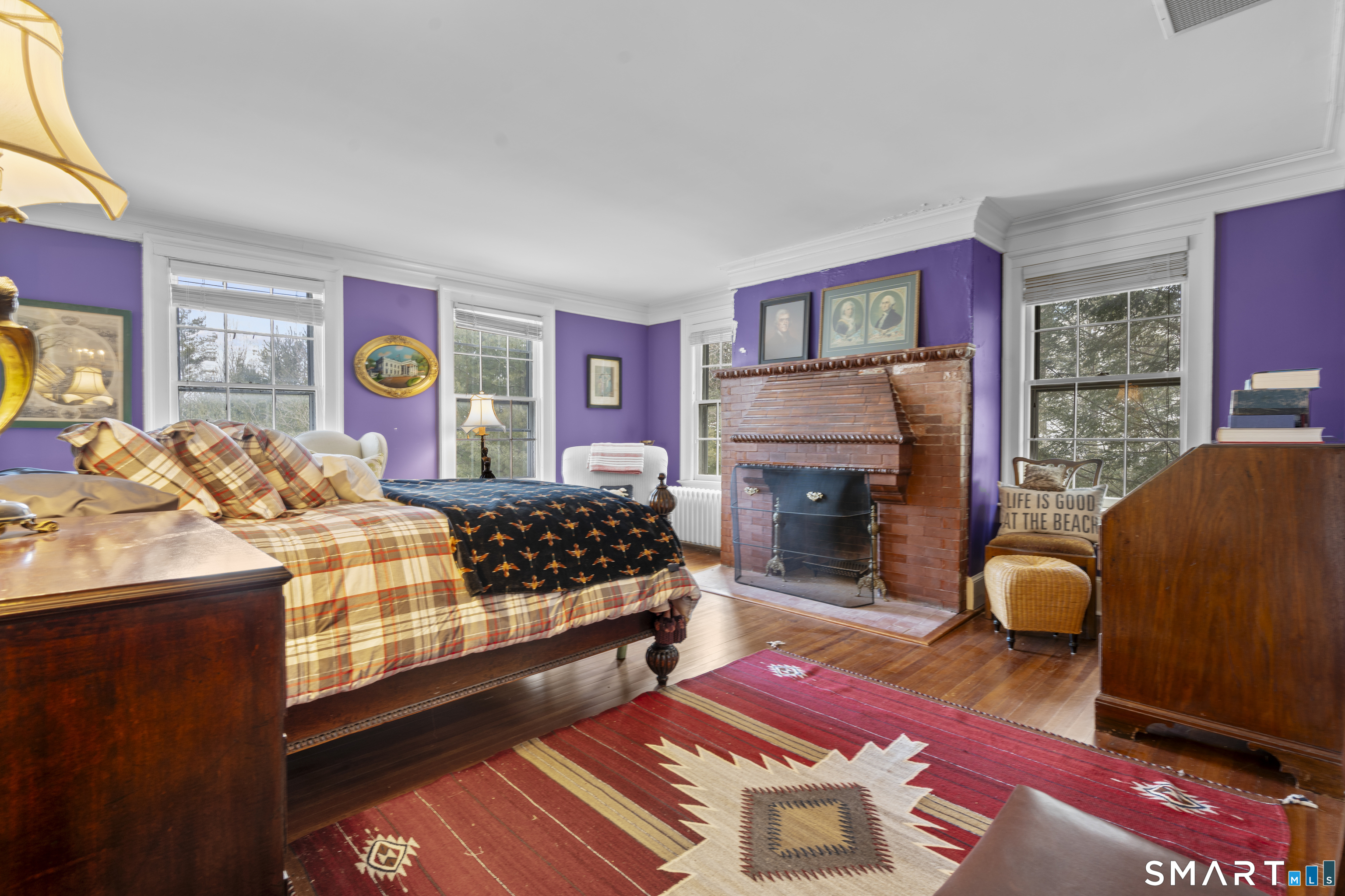 91 North Street Litchfield, CT 06759 - Photo 30 of 40 a bedroom with a bed and a fireplace