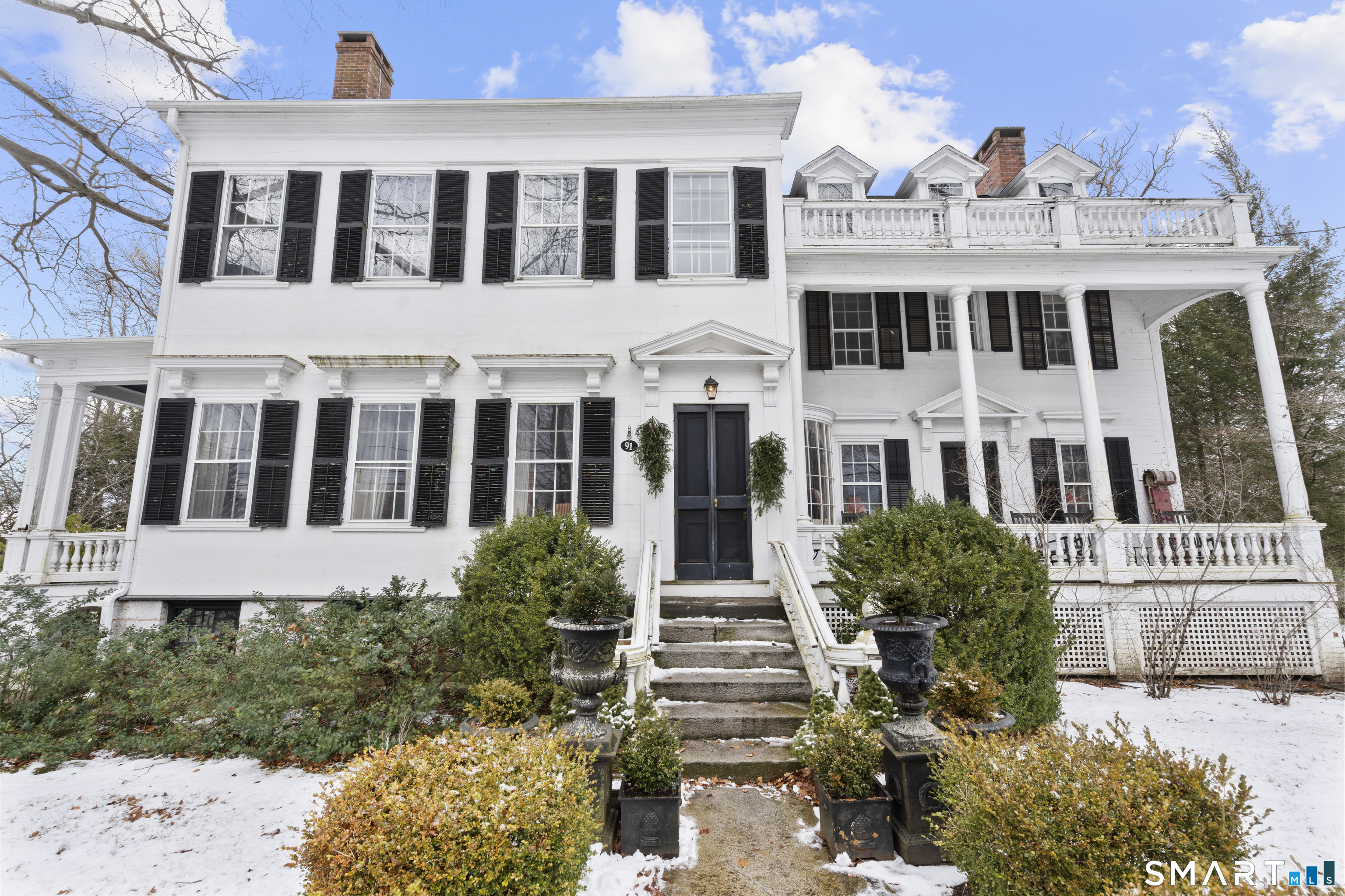 91 North Street Litchfield, CT 06759 - Photo 3 of 40 a view of a building with a garden