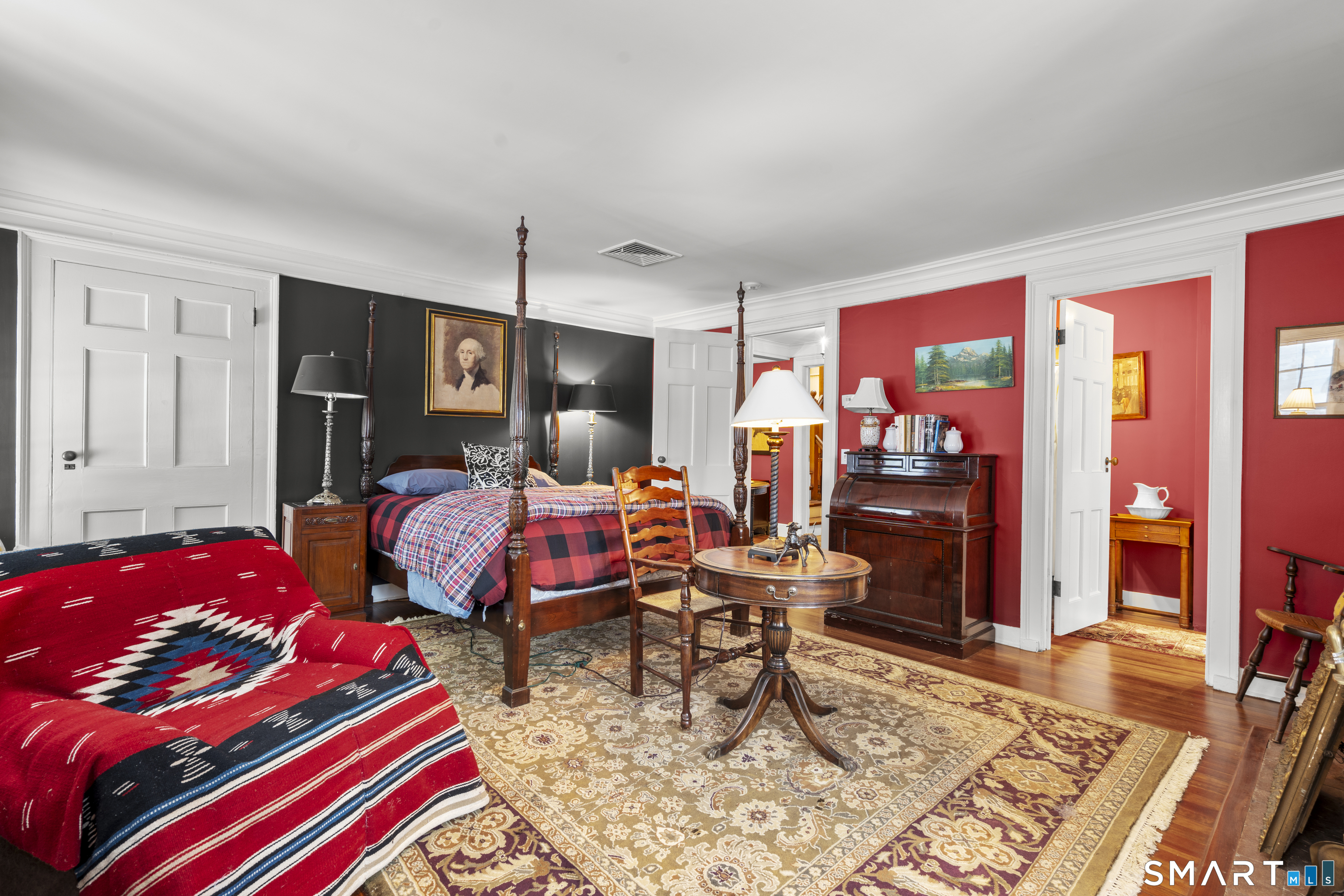 91 North Street Litchfield, CT 06759 - Photo 34 of 40 a bedroom with a bed and wooden floor