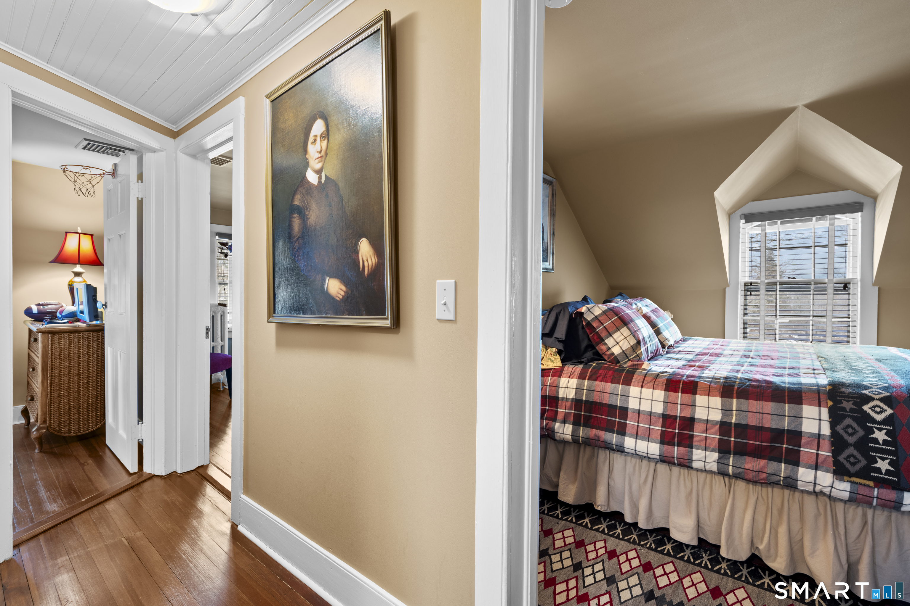 91 North Street Litchfield, CT 06759 - Photo 37 of 40 a bedroom with a bed and wooden floor