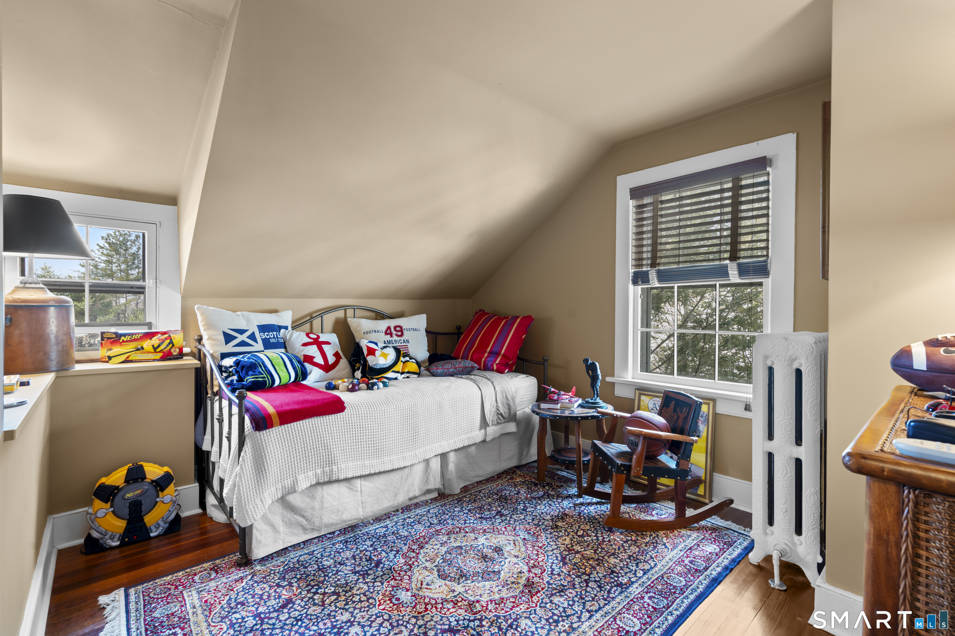 91 North Street Litchfield, CT 06759 - Photo 39 of 40 a bedroom with baby bed and a couch