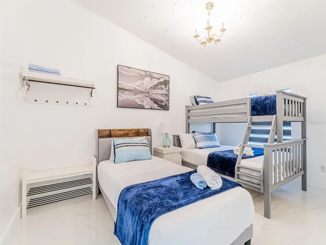 a bedroom with furniture and a window